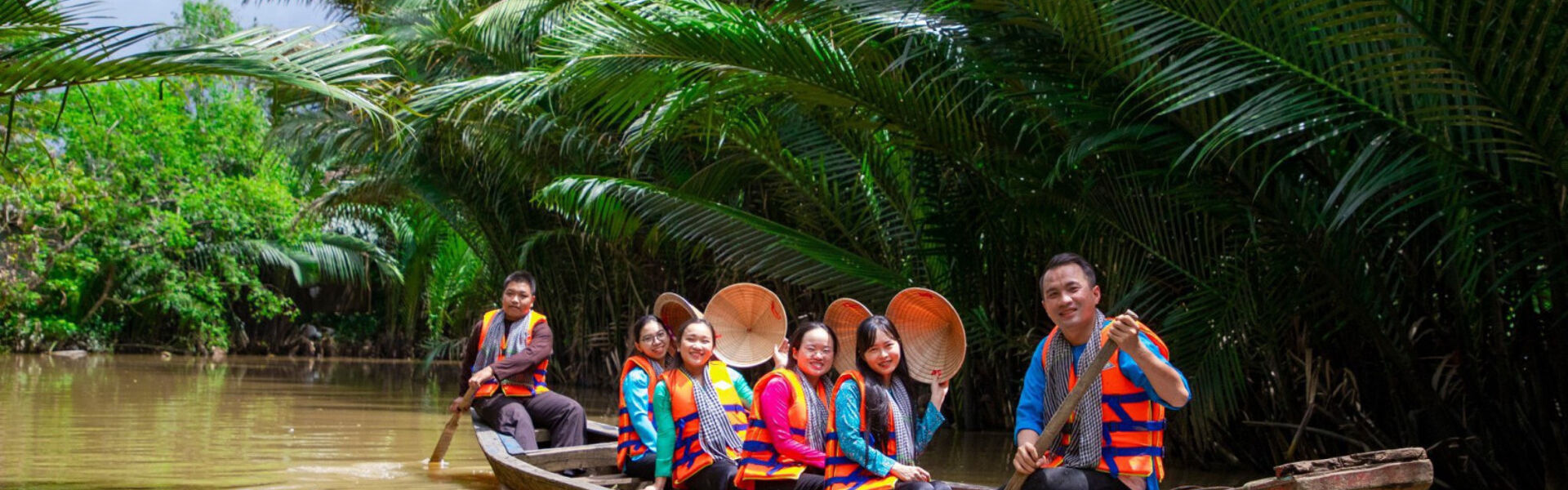 Vibrant Ben Tre orchards in Vietnam for a Ben Tre Tours banner by Legend Travel Group.